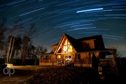 Star Trails over the Cabin star trail photo over Look Out Lodge Kentucky by Dan Bourque